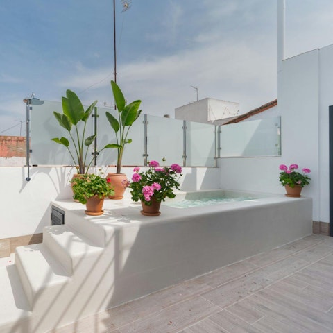 Cool off in the shared rooftop swimming pool