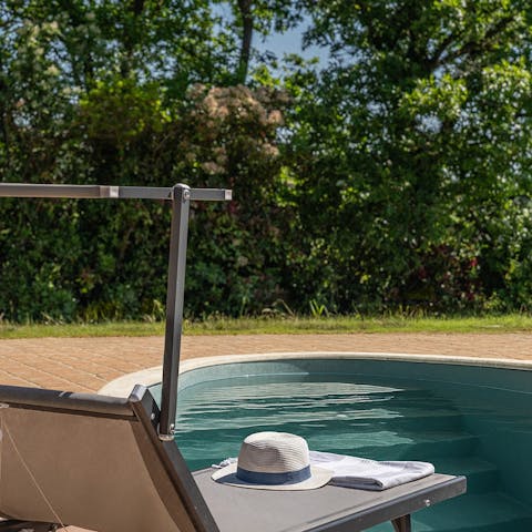 Stretch out by the shared swimming pool