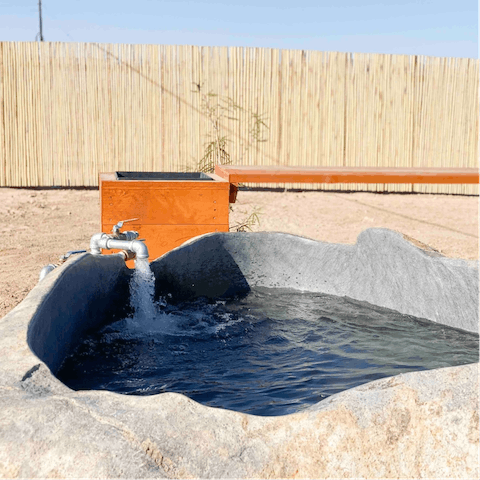 Sink into the private hot springs tub and feel your stresses slip away