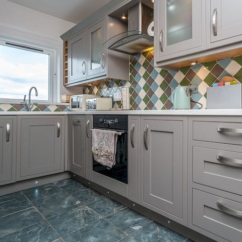 Rustle up breakfasts in the well-equipped kitchen with sea views to boot