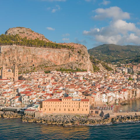 Get lost in the narrow streets of Cefalù – it's a twelve-minute drive