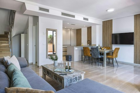Cook, dine, and unwind in one light-filled social space