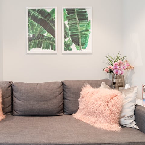 Feel at home with the comfy sofa and touches of colour and texture