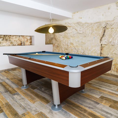 Escape the heat of the sun to play a fun game of billiards
