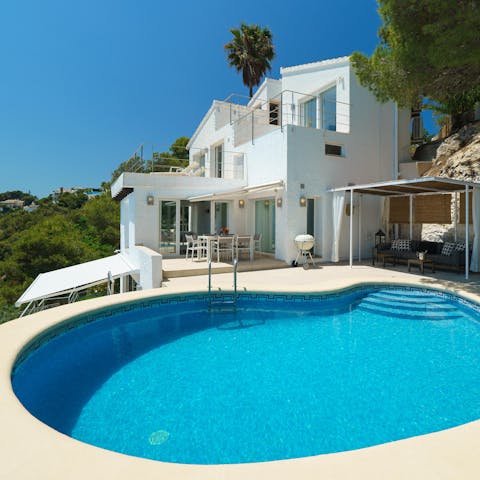 Take a refreshing dip in the kidney-shaped pool