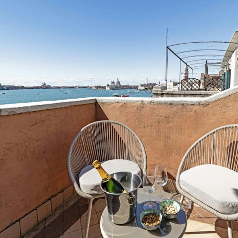 Admire the views over Venice from the private terrace