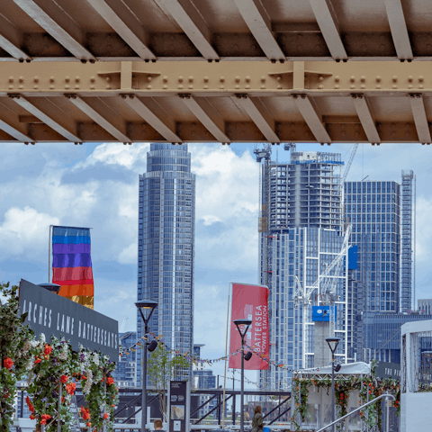 Cross Chelsea Bridge and grab a bite at Battersea Power Station