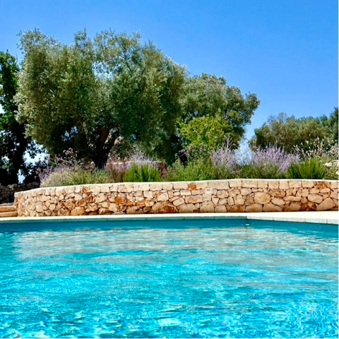 Cool off in the private swimming pool on a sunny day