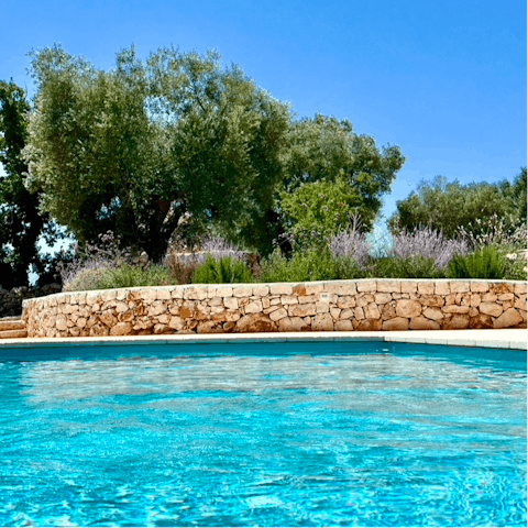 Cool off in the private swimming pool on a sunny day