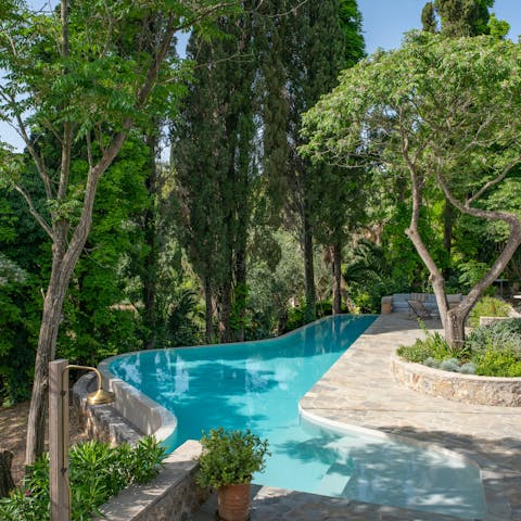 Spend blissful days by the pool or walk down to the private beach