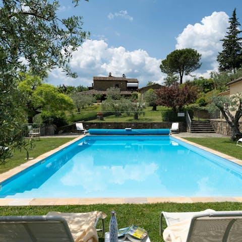 Let the day slip away as you relax by the swimming pool