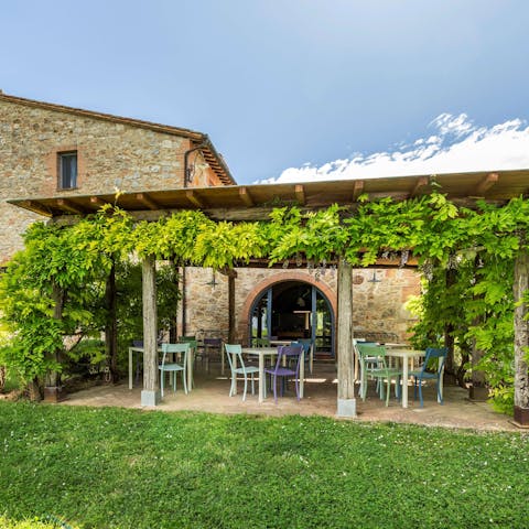 Dig into a professionally prepared meal in the shade of the terrace