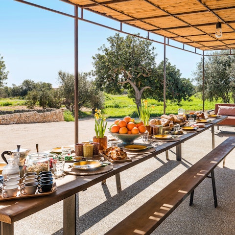 Feast al fresco beneath the shaded pergola, Italian-style