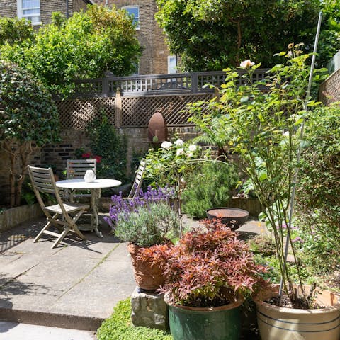 Sip your morning cuppa in the flower-filled garden