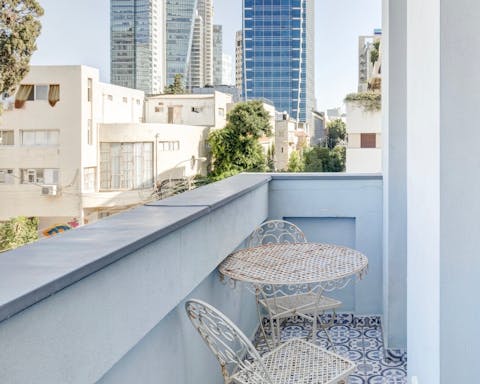 A balcony with city views