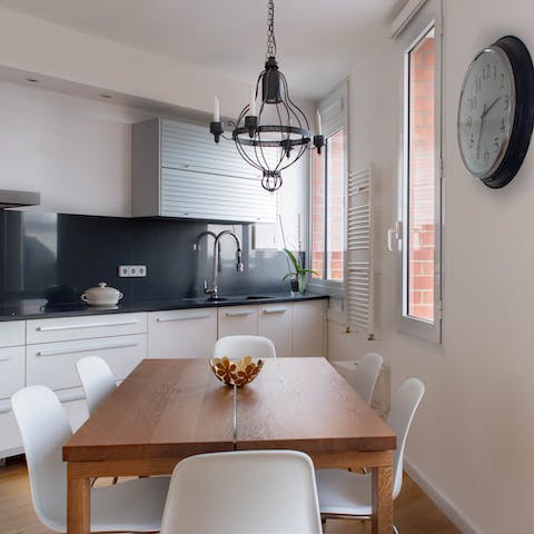 Pour a glass of wine and gather round in the luminous dining area