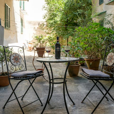 Enjoy a glass of Tuscan wine on the private terrace