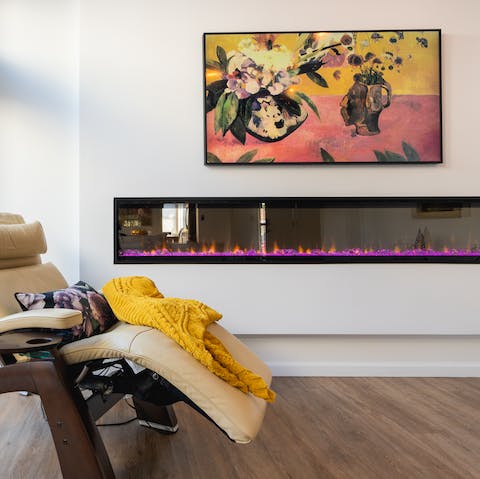Customise the living room's artwork on the sixty-five inch QLED TV