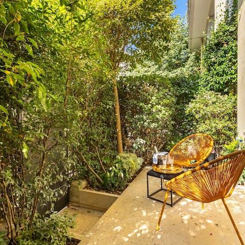 Sip French wine out on the leafy terrace at sunset