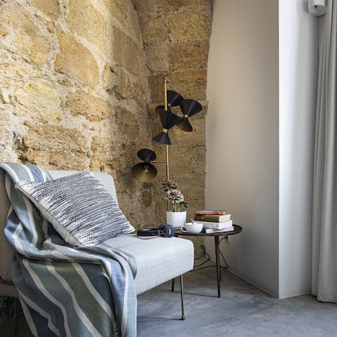 Unwind in the comfy antique chair after a day of discovering Lisbon