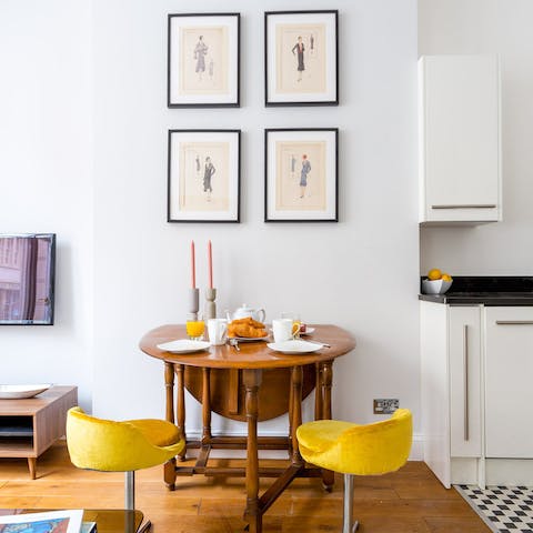 Sit down for breakfast in a stylish dining area with tasteful artwork