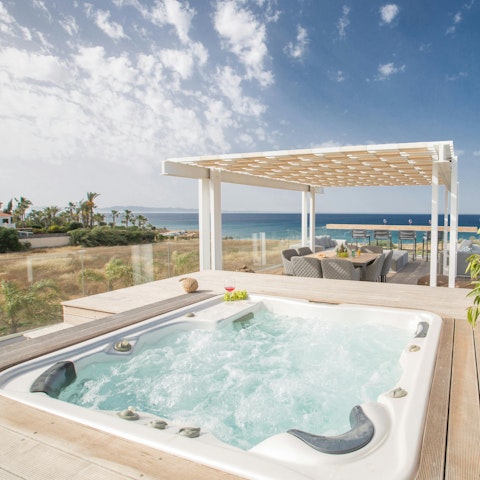 Admire sea views from the hot tub