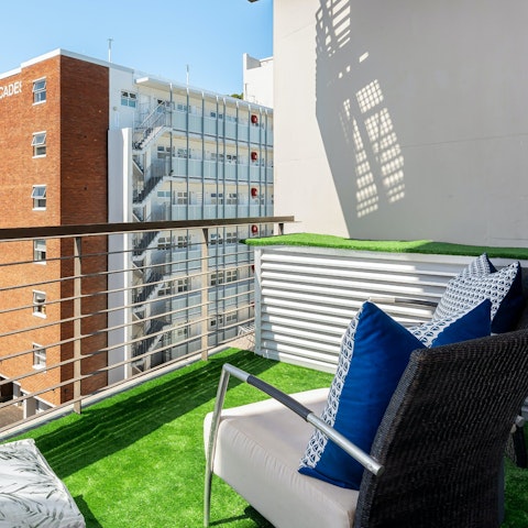 Enjoy a glass of South African wine on the private balcony