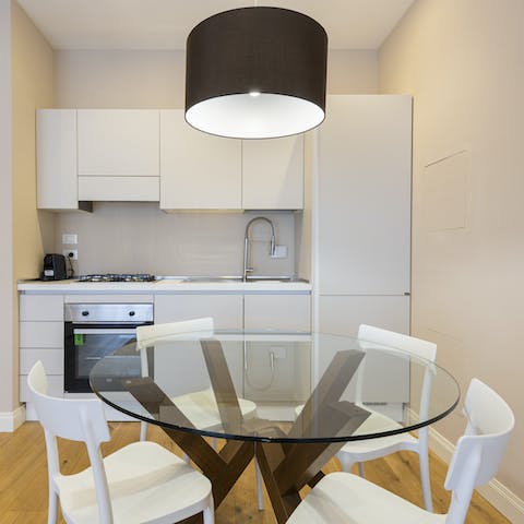Gather together for a celebratory soirée at the glass dining table