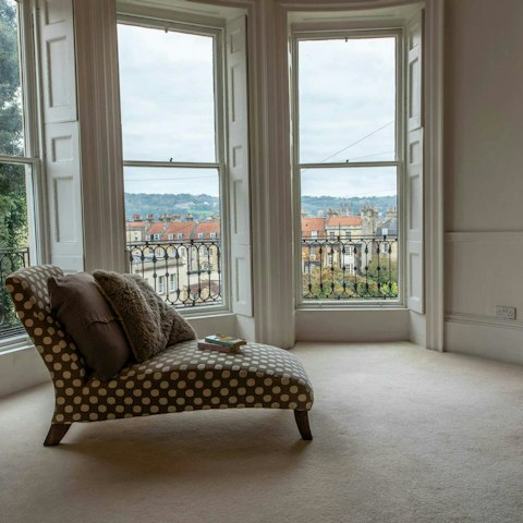 Admire views of the city as you relax in the bedroom