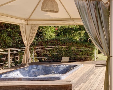 Unwind in the hot tub under the gazebo