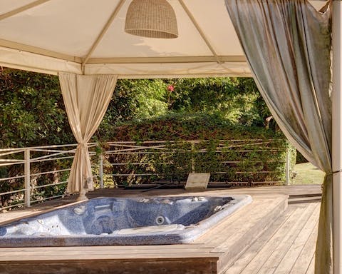 Unwind in the hot tub under the gazebo