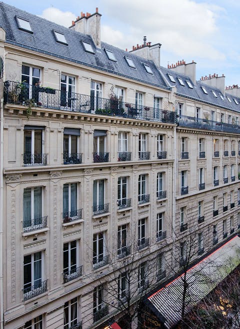 Wake up to stunning views overlooking he Haussmanian buildings on the street below