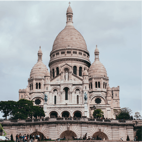 Marvel at the Sacré-Cœur's beauty with a visit to Montmartre, twenty-five minutes away on foot