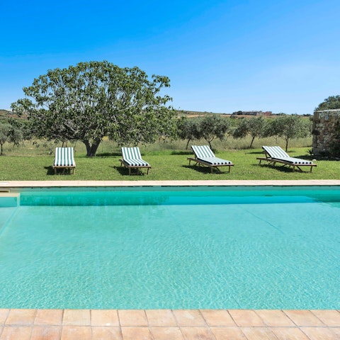 Take a dip in the turquoise swimming pool