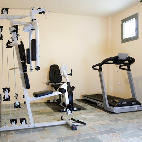 Stay on top of your fitness routine with a workout in the private gym
