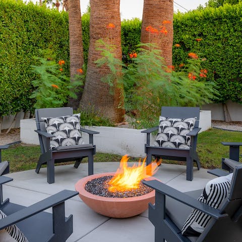 Pour a glass of your favourite drink and gather around the fire pit