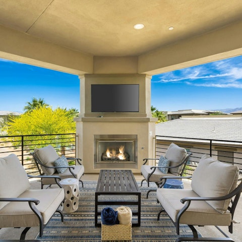 Relax on the terrace with its outdoor fireplace and TV