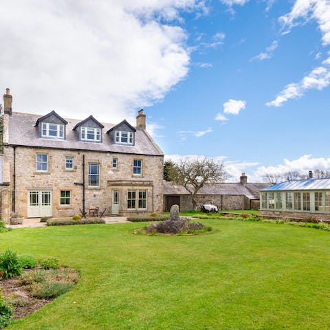 Head out into the home's large garden when the sun makes an appearance