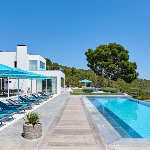 Find a blissful spot to lounge in the sun by the pool