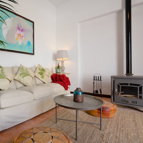 Snuggle up in the cosy livining room by the warmth of the wood burner