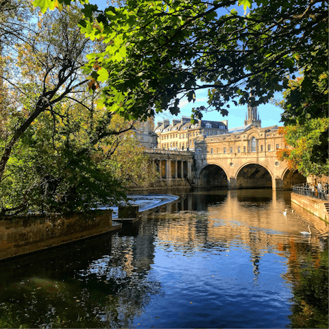 Walk across the beautiful Pulteney Bridge on the River Avon, a three-minute walk away