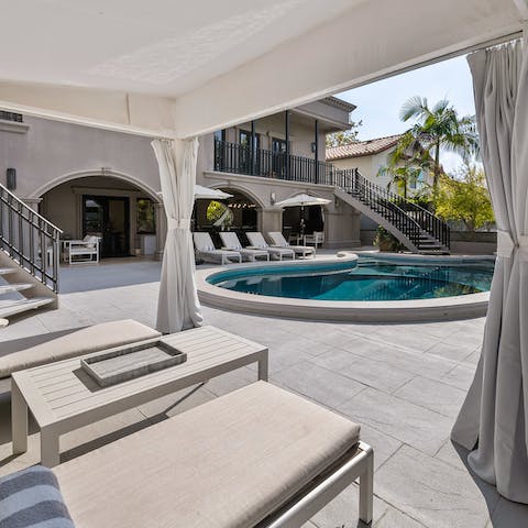 Move between the shade of the cabana and the private pool
