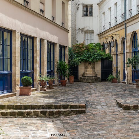 Return home through the quaint and private courtyard