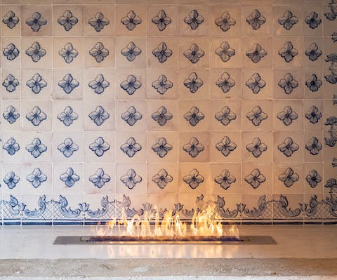 Admire original features including the tiled gas fireplace