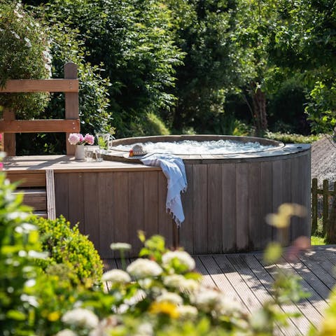 Soak in the private hot tub under the stars