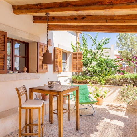 Enjoy a glass of sangria on the shaded patio while enjoying the warm air perfumed with bougainvilleas