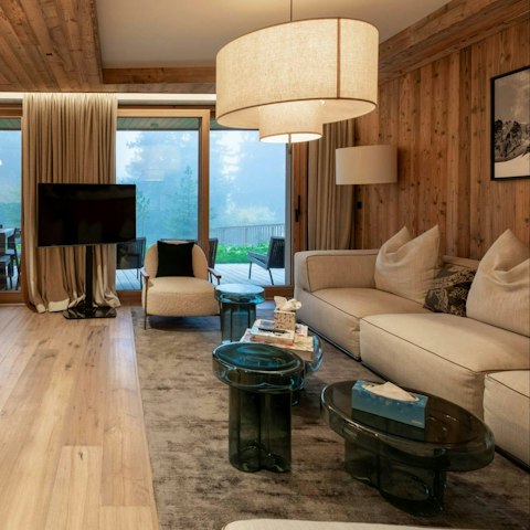 Settle into the living space with forest views beyond