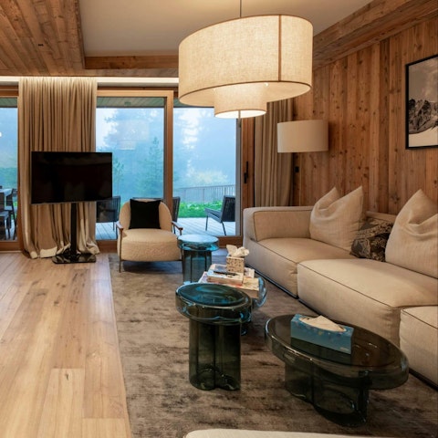 Settle into the living space with forest views beyond