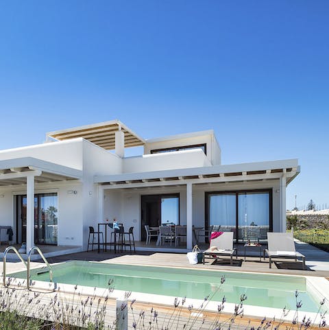 Spend a slow day relaxing by the pool and enjoy the additional feature of the hot tub