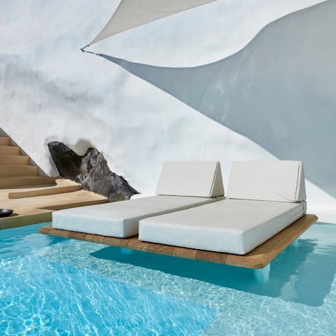 While away on the floating sun loungers from the pool